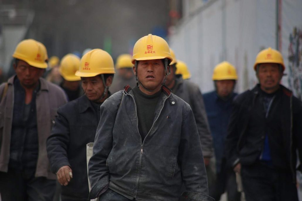 рабочий китайский мигрант