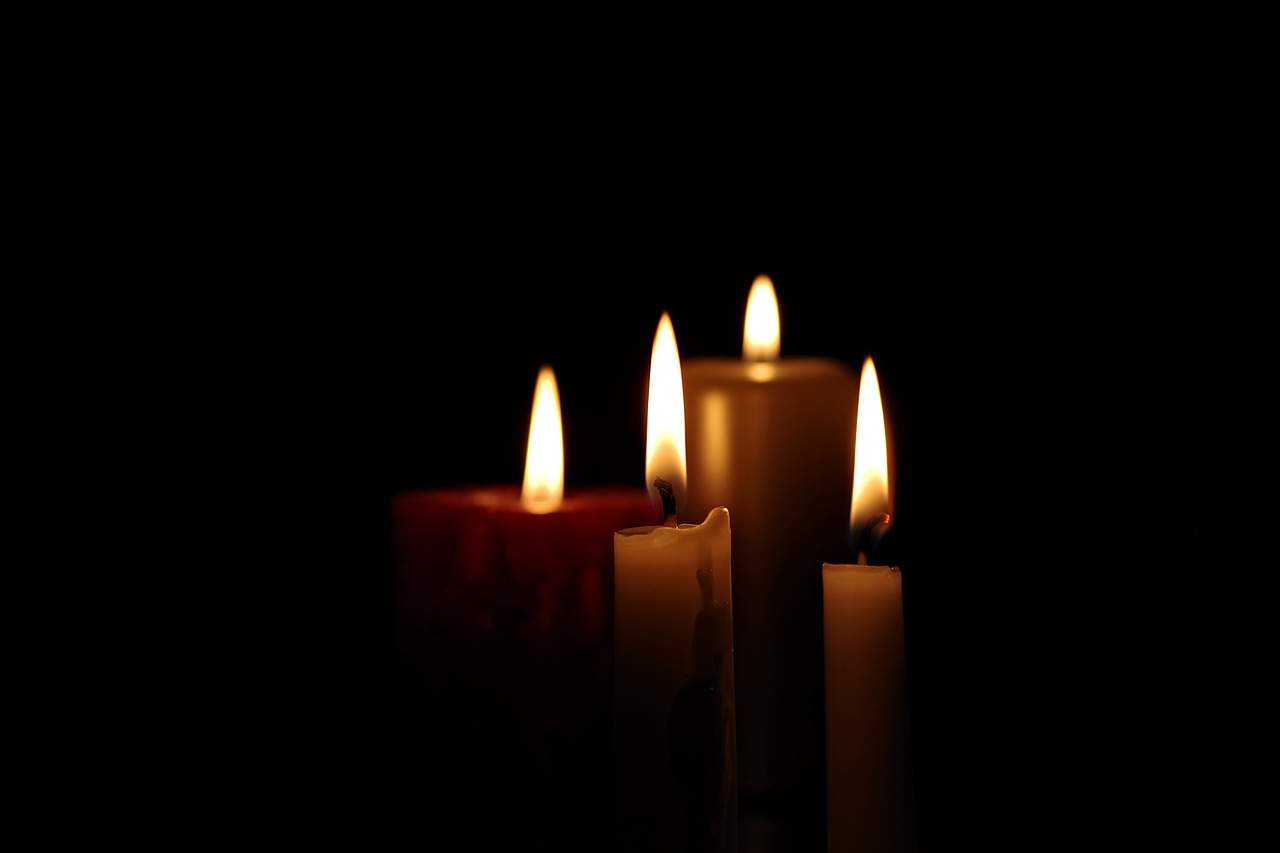 Ognissanti, candela, lutto