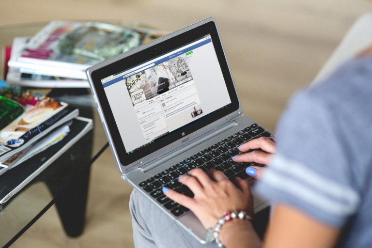 hands-woman-laptop-notebook-facebook