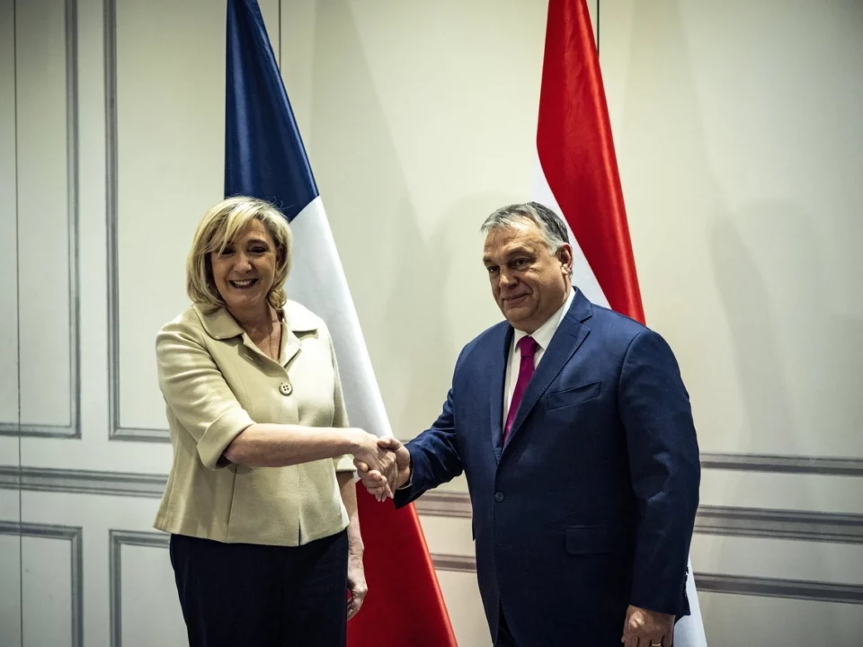 Hungarian Prime Minister Viktor Orbán talks with Marine Le Pen