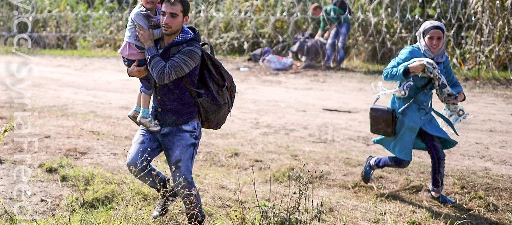 Familia de refugiați granița cu Ungaria