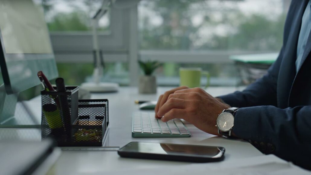 closeup-manager-hands-typing-computer-keyboard-pe-2023-05-17-00-12-28-utc (1)