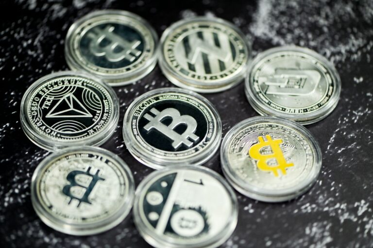 a pile of bitcoins sitting on top of a table crypto mixers
