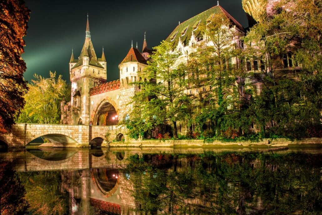 Vajdahunyad castle at the night with lake in Budapest, Hungary