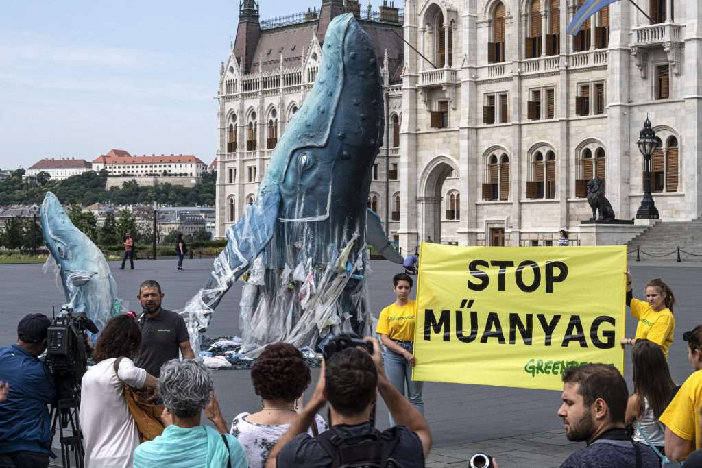 Greenpeace protest plastic pollution with lifesize whales in Budapest