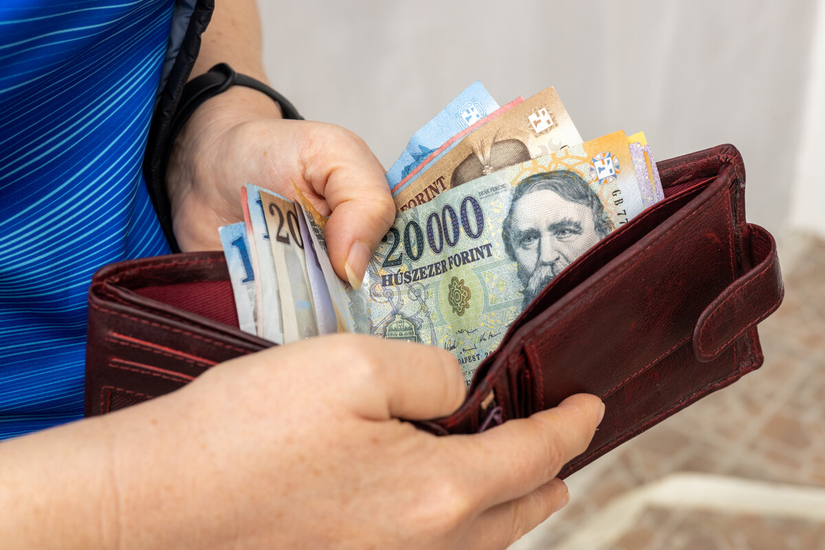 Hungary forint increase wallet hand finance minimum wage